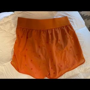 Lululemon orange Hotty hot shorts size 6.